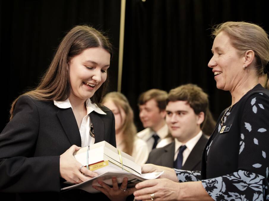 Brianna Hefren at Cootamundra High School's annual presentation evening receiving her awards from Principal Leesa Daly. See story front page.