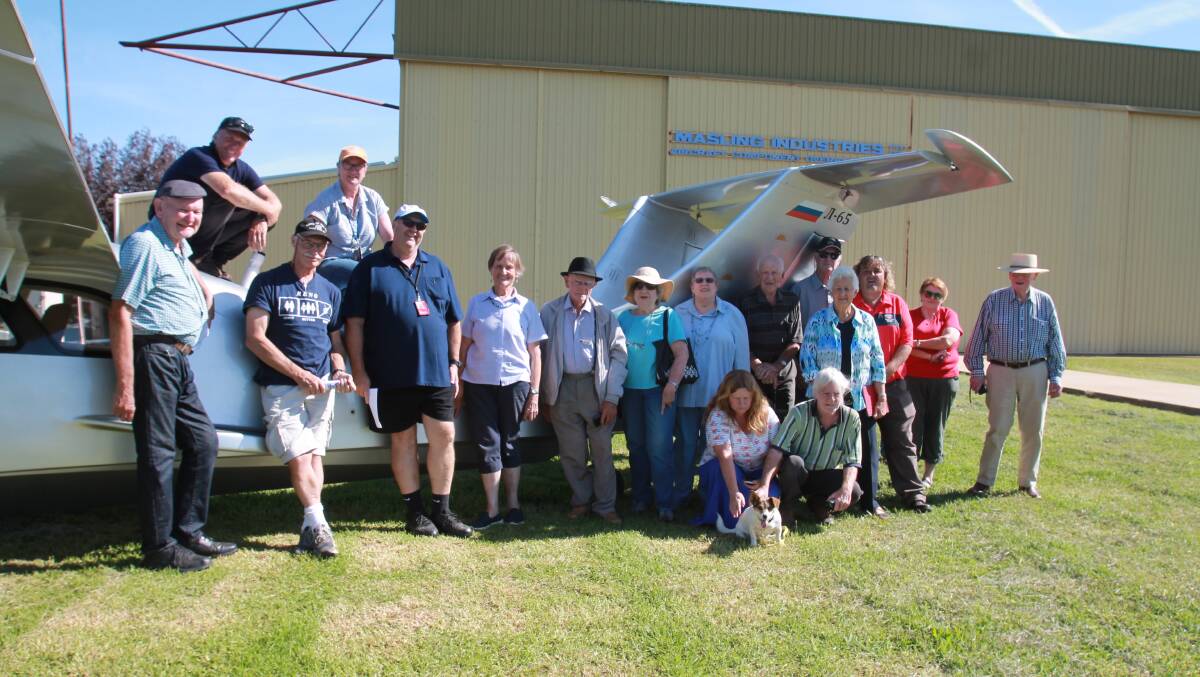 Well behaved: (l-r) Organiser Tom Lockley, with pilots Michael Smith, John Daley, Louise Humble and Michael Coates, and some of the Cootamundra crowd on Wednesday.