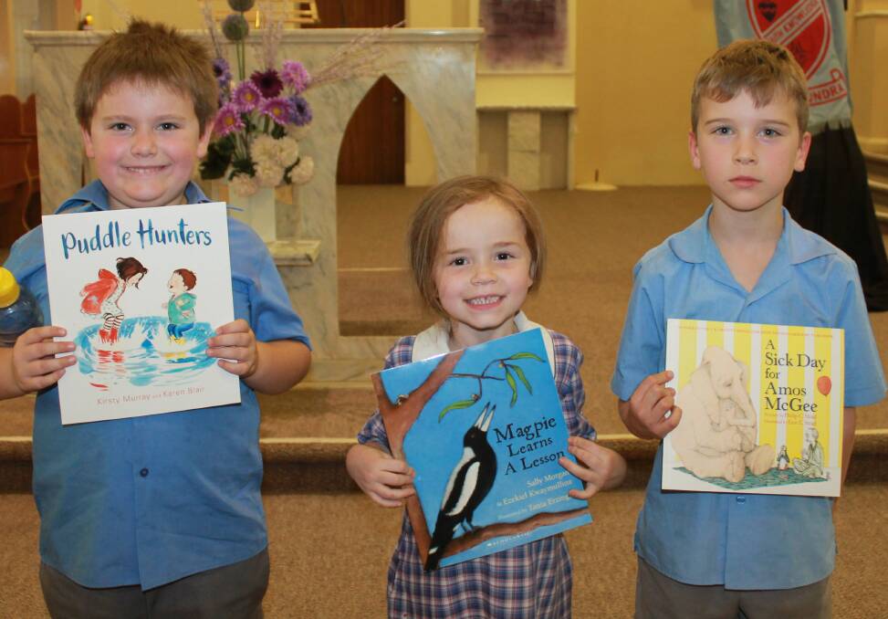 Sacred Heart students Heath Frost, Danielle Sargent and Jimmy Last with their Lions Club Kindy Book awards. 