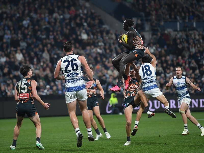 Leek Aleer soars to claim the match-clinching mark for GWS against Geelong. (Julian Smith/AAP PHOTOS)