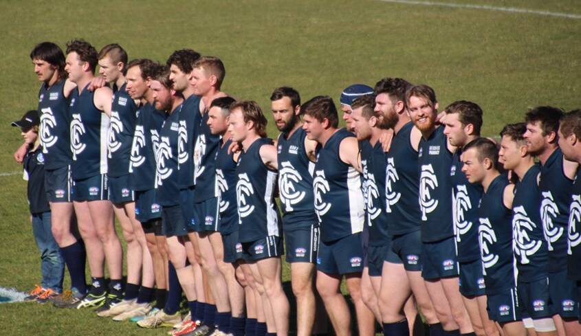 SHATTERED: The Coota Blues, pictured before Saturday's big game, were shattered to go through the season undefeated only to lose the grand final. Photo: MARK LOITERTON